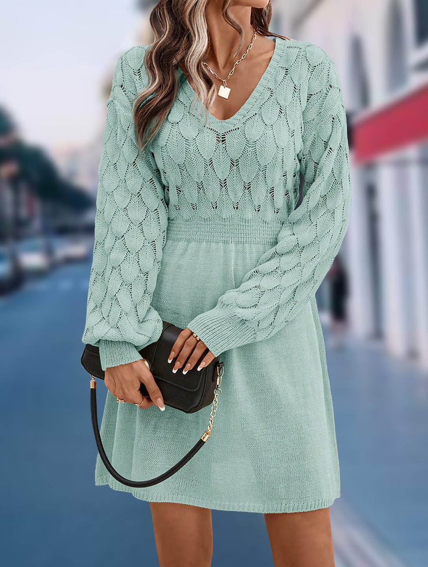 Light blue crochet V-neck A-line beach dress by FJØRNA, featuring a flowy silhouette and intricate knit pattern.