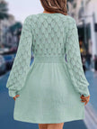 Light blue crochet V-neck A-line beach dress by FJØRNA featuring a flowy silhouette and intricate crochet details.