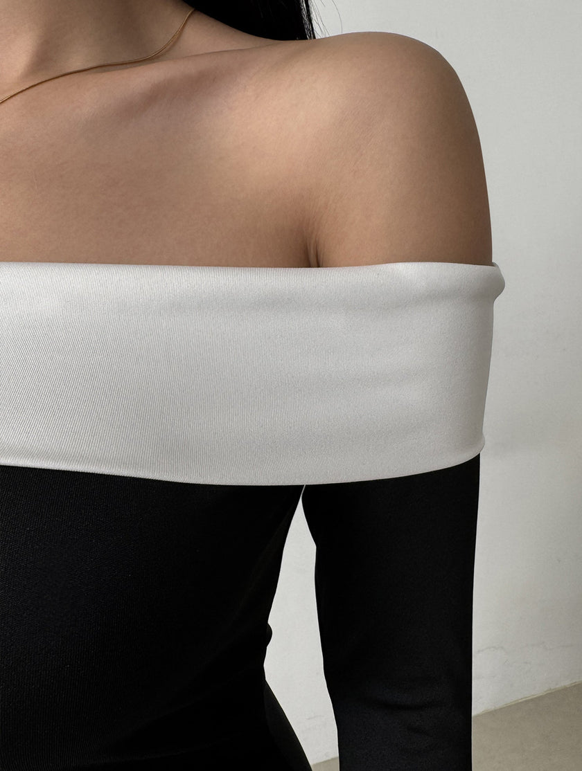 FJØRNA off-shoulder bell sleeve white dress, featuring ruffled sleeves and a flowing silhouette, perfect for elegant occasions.