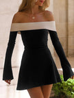 FJØRNA white off-shoulder bell sleeve dress displayed on a hanger with flowing fabric and stylish design.