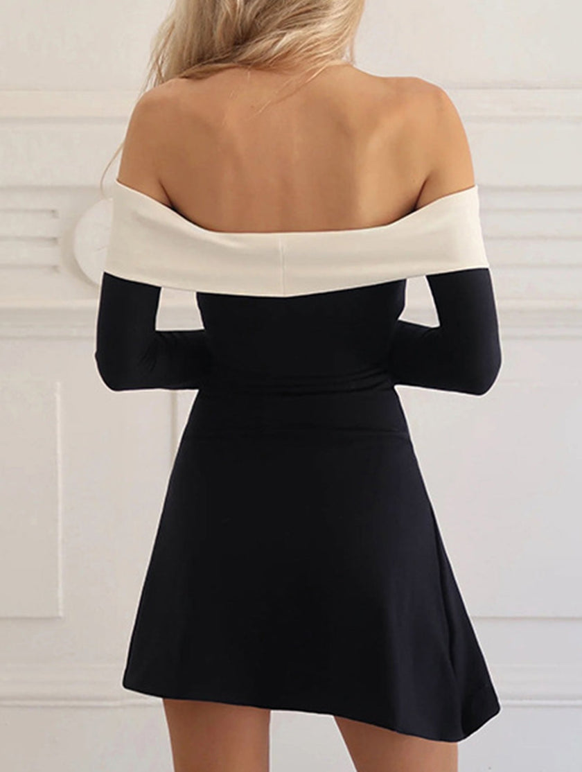 White off-shoulder bell sleeve dress by FJØRNA, with flowing fabric and stylish design, displayed on a hanger.