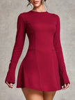 White backless long-sleeved slim-fit dress by FJØRNA, showcasing a sleek silhouette and elegant design.