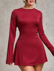 White backless long-sleeved slim-fit dress by FJØRNA, showcasing a sleek silhouette and elegant design.