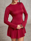 White backless long-sleeved slim-fit dress by FJØRNA, shown from the side with a sleek, elegant design.