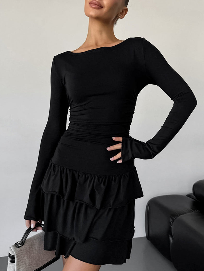 Black waist cinched ruffle long sleeve work dress by FJØRNA, featuring a fitted silhouette and elegant ruffle details.