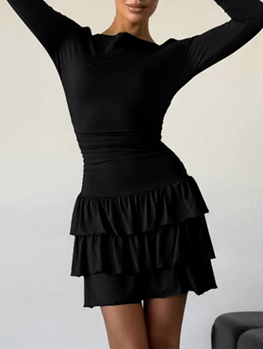 FJØRNA waist cinched ruffle long sleeve work dress in white, featuring a fitted silhouette and elegant ruffle details.