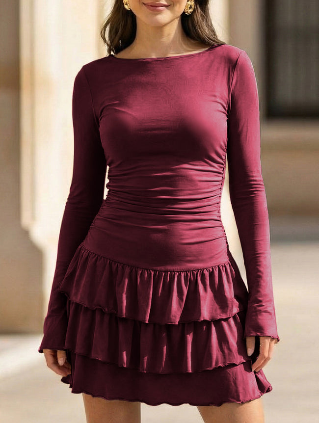 White waist cinched ruffle long sleeve work dress by FJØRNA, featuring a stylish silhouette and elegant ruffle details.
