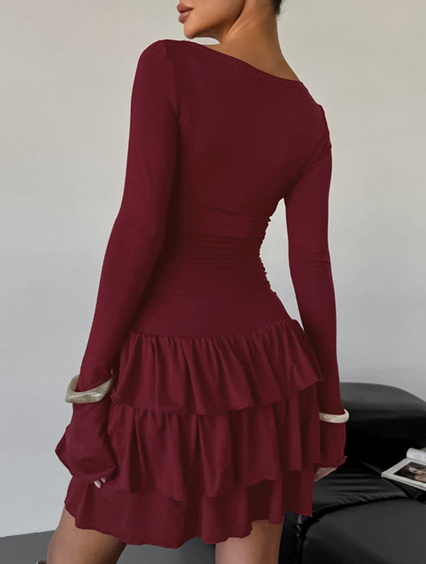 White FJØRNA waist cinched ruffle long sleeve work dress with feminine ruffle details and fitted silhouette.
