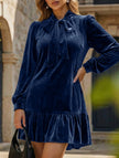 White vintage loose-fit long sleeve mini dress by FJØRNA with solid design and relaxed style, perfect for casual wear.