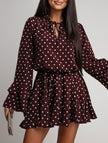 Dark brown polka dot V-neck long sleeve midi dress by FJØRNA, featuring a classic white polka dot pattern and a flattering silhouette.
