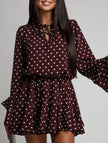 FJØRNA polka dot white V-neck long sleeve midi dress with dark brown polka dot pattern, stylish and elegant for casual or formal wear.