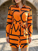 Orange floral long-sleeved casual shirt dress for women by FJØRNA, perfect for casual wear or wedding occasions.