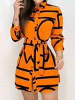 Orange floral long-sleeve casual shirt dress for women by FJØRNA, perfect for relaxed or wedding occasions.