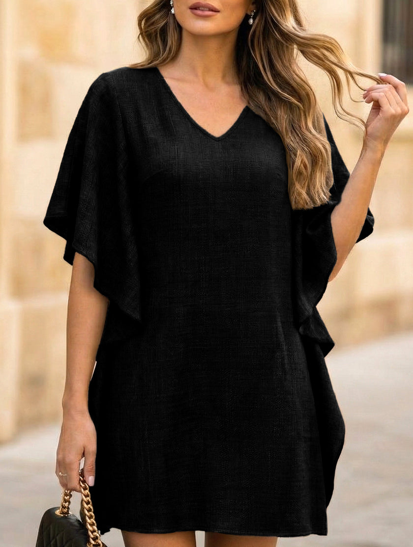 Black solid loose ruffle V-neck flowy dress by FJØRNA, featuring a relaxed fit and elegant ruffle details in a flowy style.