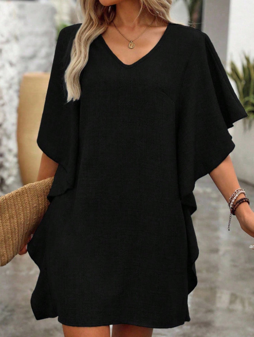 Black FJØRNA solid loose ruffle V-neck flowy dress featuring a relaxed fit and elegant ruffle details.