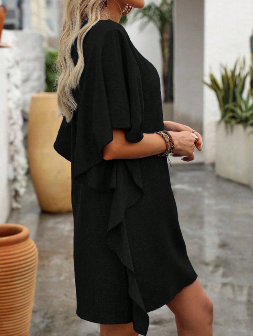 Black solid loose ruffle V-neck flowy dress by FJØRNA, featuring a relaxed fit with ruffled accents and a stylish V neckline.