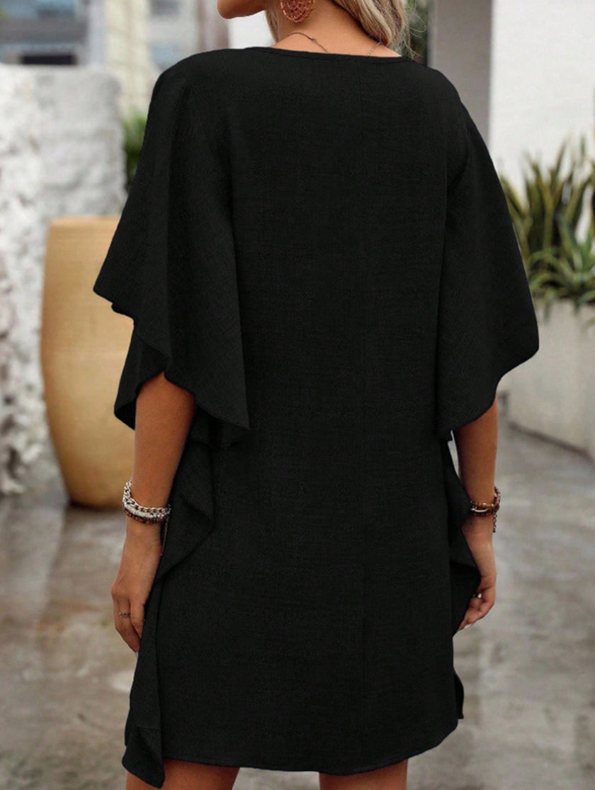 Black FJØRNA solid loose ruffle V-neck flowy dress with lightweight fabric and feminine design, perfect for casual or semi-formal wear.