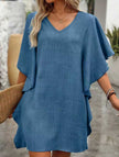 FJØRNA solid white loose ruffle V-neck flowy dress, lightweight with cascading ruffles, casual and elegant for warm weather.