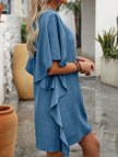 Blue FJØRNA solid loose ruffle v-neck flowy dress with a relaxed fit, lightweight fabric, and stylish ruffle details.