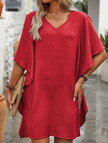 White FJØRNA solid loose ruffle v-neck flowy dress with relaxed fit and feminine ruffle details, perfect for casual or special occasions.
