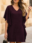 White FJØRNA solid loose ruffle V-neck flowy dress with a relaxed fit and elegant design, perfect for casual or semi-formal wear.