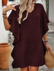 White FJØRNA solid loose ruffle V-neck flowy dress with a relaxed fit and elegant design, perfect for casual or semi-formal occasions.
