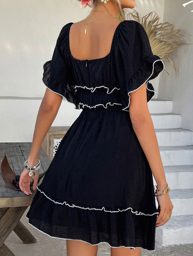 FJØRNA French square neck ruffle A-line dress in white, featuring a fitted bodice, ruffled details, and a flowing skirt.