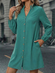 FJØRNA solid white long sleeve A-line midi dress displayed on a hanger, showcasing its elegant midi length and classic design.