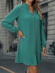 White FJØRNA solid long sleeve A-line midi dress displayed on a hanger with a simple background.
