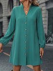 FJØRNA solid white long sleeve A-line midi dress, stylish and elegant, displayed on a hanger against a neutral background.