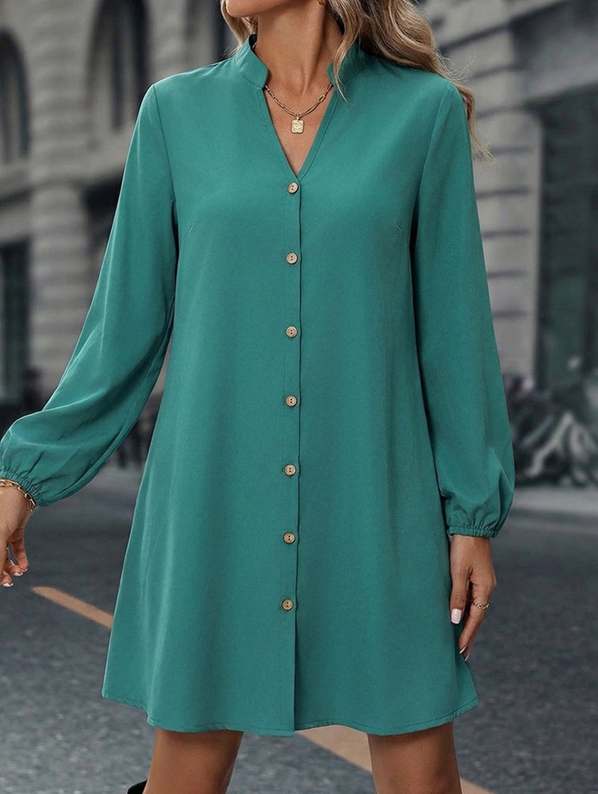 FJØRNA solid white long sleeve A-line midi dress, stylish and elegant, displayed on a hanger against a neutral background.