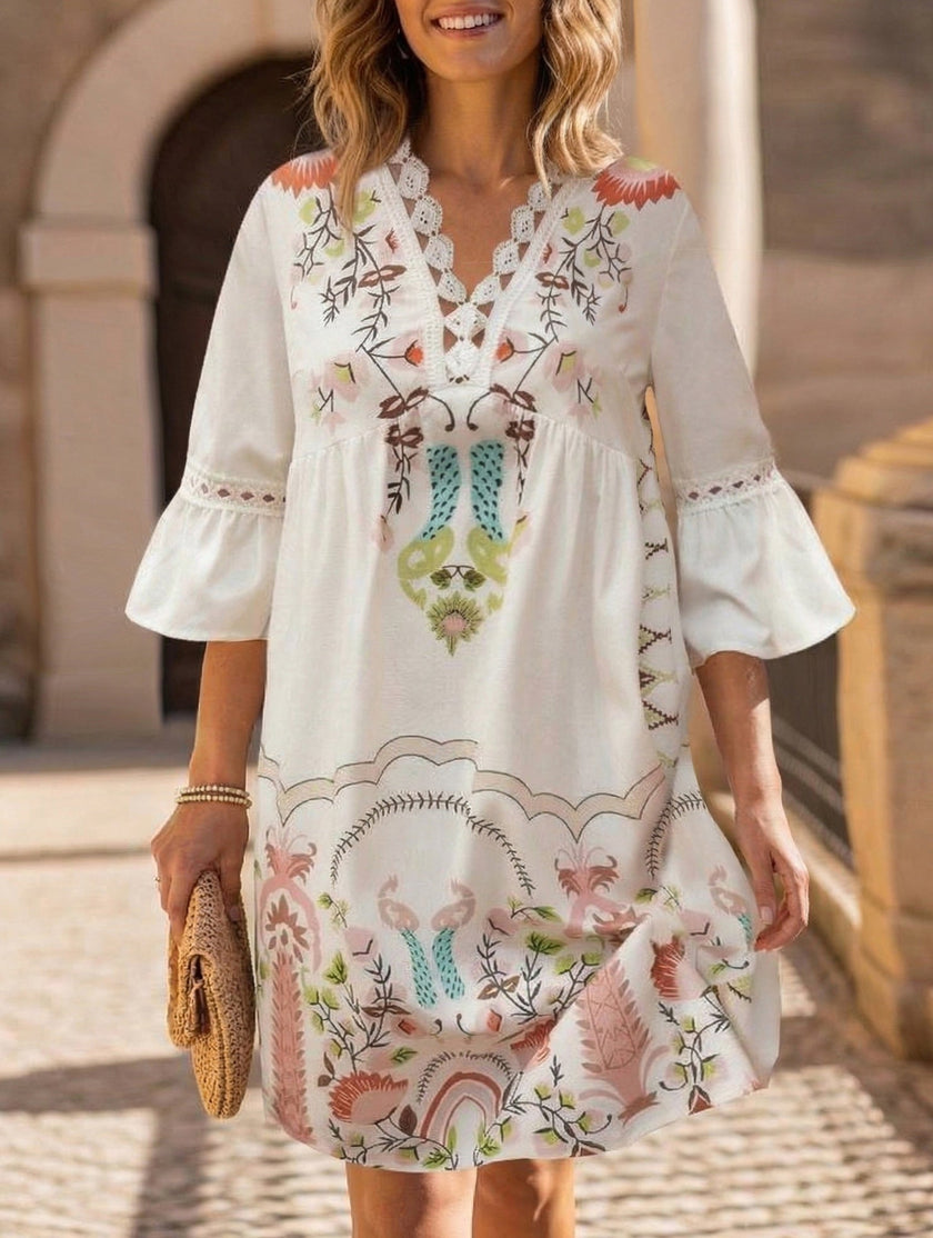 White V-neck lace patch print dress by FJØRNA, featuring a stylish design and delicate lace details.