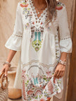 White V-neck lace patch print dress by FJØRNA, featuring a stylish design with intricate lace details and a flattering silhouette.