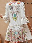 FJØRNA white V-neck lace patch print dress with intricate lace details and a flowing silhouette, perfect for elegant occasions.