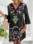 Black V-neck lace patch print dress by FJØRNA featuring a stylish design and elegant fit.