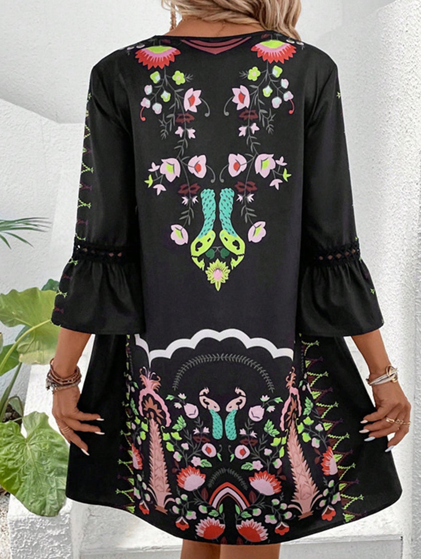 FJØRNA white V-neck lace patch print dress with long sleeves, elegant design, and intricate lace details for women.