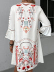 White V-neck lace patch print dress by FJØRNA featuring a stylish design and elegant silhouette.