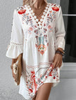 White V-neck lace patch print dress by FJØRNA, featuring intricate lace details and a stylish V-neck design.