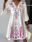 White V-neck lace patch print dress by FJØRNA featuring a flowy silhouette and elegant design.
