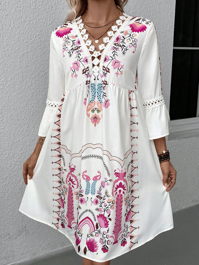 White V neck lace patch print dress by FJØRNA featuring a stylish design and elegant fabric, perfect for casual or semi-formal wear.