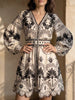 Black printed beach mini dress by FJØRNA, lightweight with floral pattern, perfect for summer beach outings.