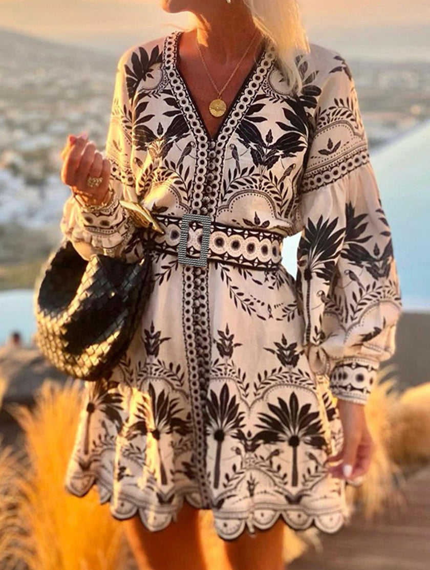 Black printed beach mini dress by FJØRNA featuring lightweight fabric and casual fit, perfect for summer and beach outings.
