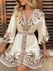 FJØRNA white tie waist print midi dress with a flowy silhouette and apricot floral pattern, perfect for summer wear.