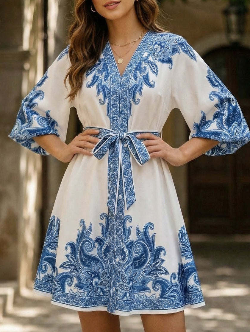 FJØRNA blue tie waist print midi dress featuring a relaxed fit and elegant design, perfect for casual or semi-formal occasions.