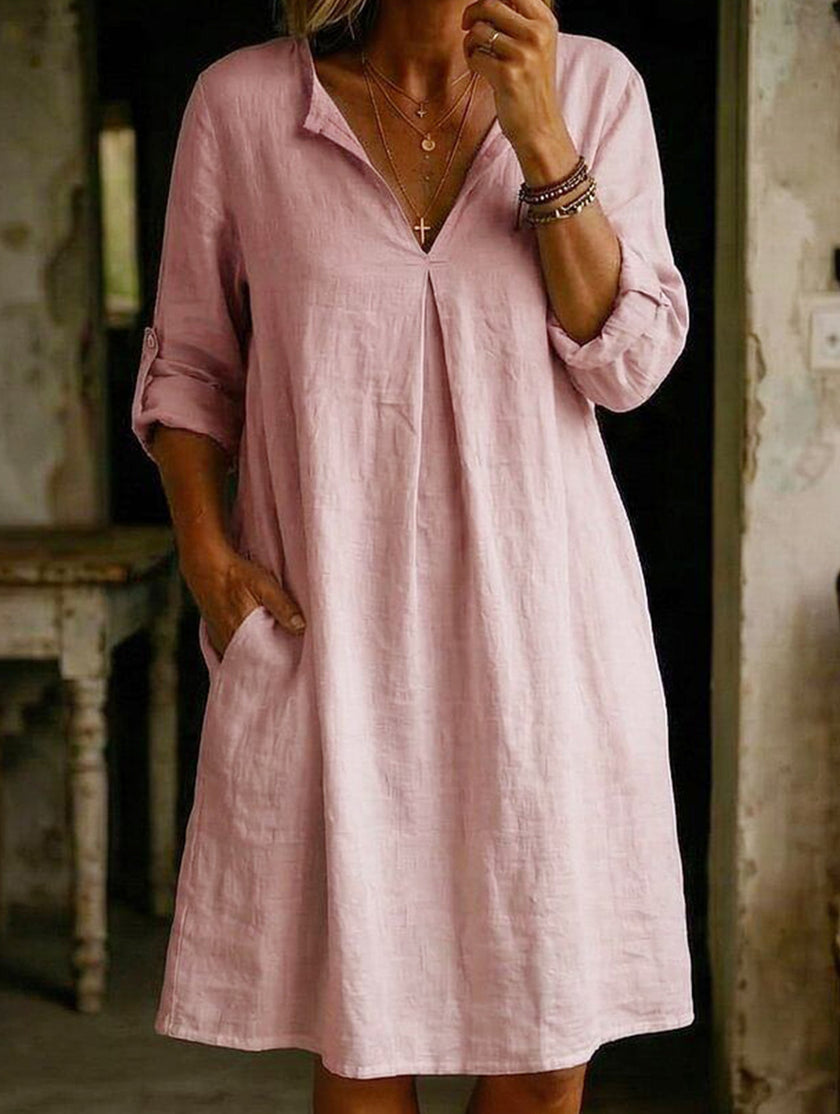 White linen V-neck short sleeve dress by FJØRNA, relaxed fit with clean, minimal design perfect for warm weather.