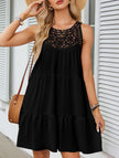 Black lace patch halter A-line dress by FJØRNA, featuring a stylish neckline and flowing silhouette, shown on a model.