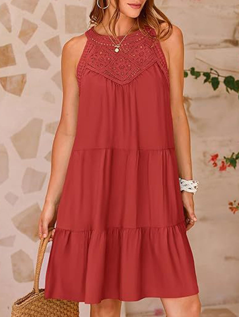 FJØRNA lace patch halter A-line dress in brick color, featuring a fitted bodice, flared skirt, and delicate lace details.