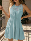 Light green FJØRNA lace patch halter A-line dress with fitted waist and flowing skirt, perfect for summer occasions.
