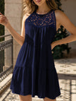 Navy lace patch halter A-line dress by FJØRNA, featuring a fitted bodice, flared skirt, and elegant lace detailing.