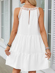 White lace patch halter A-line dress by FJØRNA, showcasing the elegant neckline and flowy skirt design.
